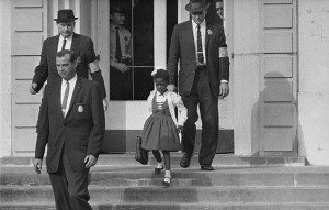 US marshals with young Ruby Bridges on school steps / Associated Press
